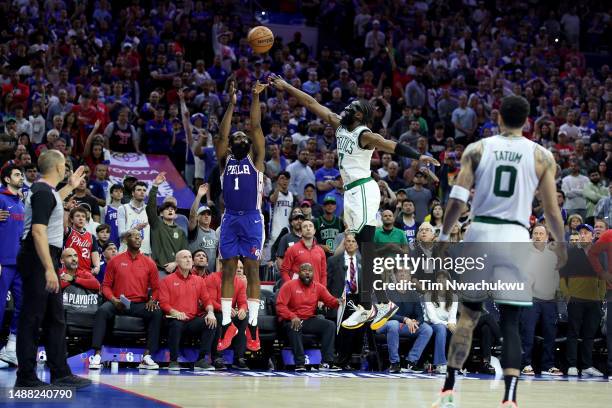James Harden of the Philadelphia 76ers shoots the game winning three point basket against Jaylen Brown of the Boston Celtics during overtime in game...