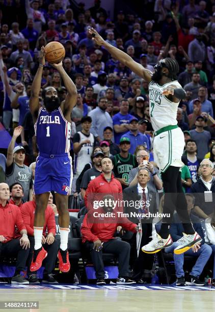 James Harden of the Philadelphia 76ers shoots the game winning three point basket against Jaylen Brown of the Boston Celtics during overtime in game...