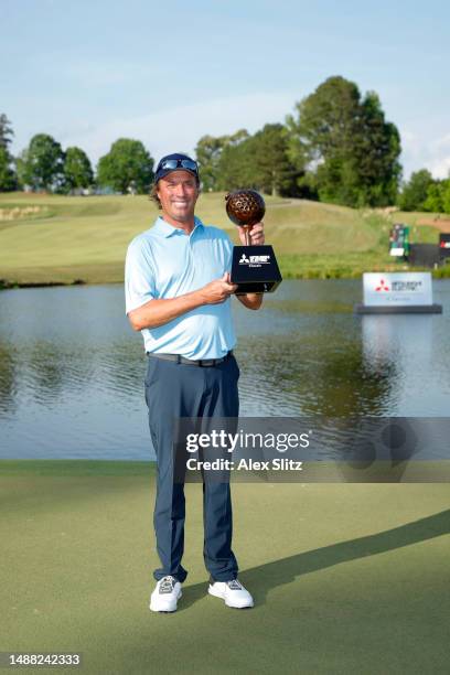 Stephen Ames of Canada celebrates with the trophy during the final round of the Mitsubishi Electric Classic at TPC Sugarloaf Golf Course on May 07,...