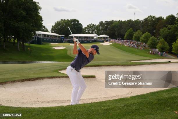 Wyndham Clark of the United States plays a shot from a fairway bunker on the 15th hole during the final round of the Wells Fargo Championship at...