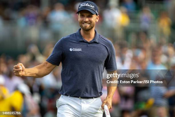 Wyndham Clark immediately celebrates after making his final putt on the 18th hole during the Final Round at the Wells Fargo Championship at Quail...