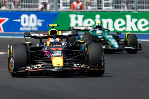 F1 Grand Prix of MiamiMIAMI, FLORIDA - MAY 07: Sergio Perez of Mexico driving the (11) Oracle Red Bull Racing RB19 leads Fernando Alonso of Spain driving the (14) Aston Martin AMR23 Mercedes during the F1 Grand Prix of Miami at Miami International Autodrome on May 07, 2023 in Miami, Florida. Honda 2026