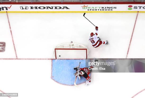 Jordan Martinook of the Carolina Hurricanes scores past Vitek Vanecek of the New Jersey Devils on a penalty shot during the second period in Game...