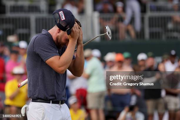 Wyndham Clark of the United States celebrates winning on the 18th green during the final round of the Wells Fargo Championship at Quail Hollow...