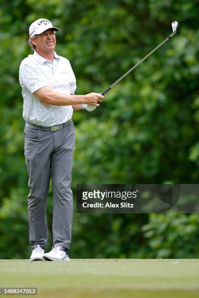 Lee Janzen of the United States watches his tee shot on the second hole during the final round of the Mitsubishi Electric Classic at TPC Sugarloaf...