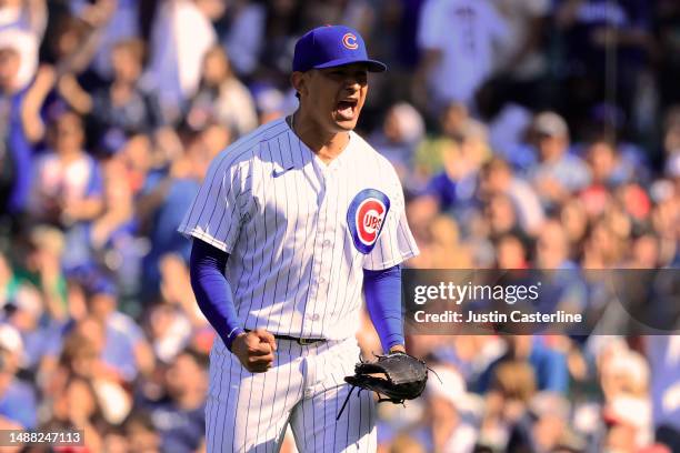 Adbert Alzolay of the Chicago Cubs reacts after a play in the 12th inning against the Miami Marlins at Wrigley Field on May 07, 2023 in Chicago,...