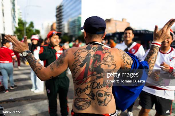 Fan of River Plate shows tattoo on the back outside the stadium prior to a Liga Profesional 2023 match between River Plate and Boca Juniors at...