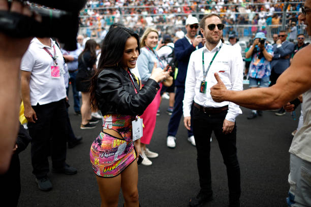 Becky G interacts with Vin Diesel on the grid prior to the F1 Grand Prix of Miami at Miami International Autodrome on May 07, 2023 in Miami, Florida.