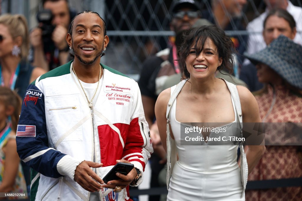 Ludacris and Michelle Rodriguez watch the grid presentation prior to... News Photo - Getty Images