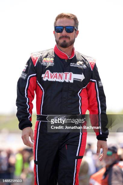 Yeley, driver of the Biohaven/Jacob Co. Ford, walks onstage during driver intros prior to the NASCAR Cup Series Advent Health 400 at Kansas Speedway...