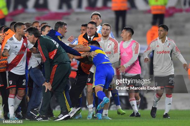 Miguel Merentiel of Boca Juniors fights with players of River Plate during a Liga Profesional 2023 match between River Plate and Boca Juniors at...