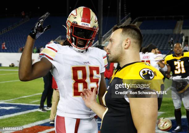 Deon Cain of the Birmingham Stallions and Chris Blewitt of the Pittsburgh Maulers talk after their game at Tom Benson Hall Of Fame Stadium on May 07,...