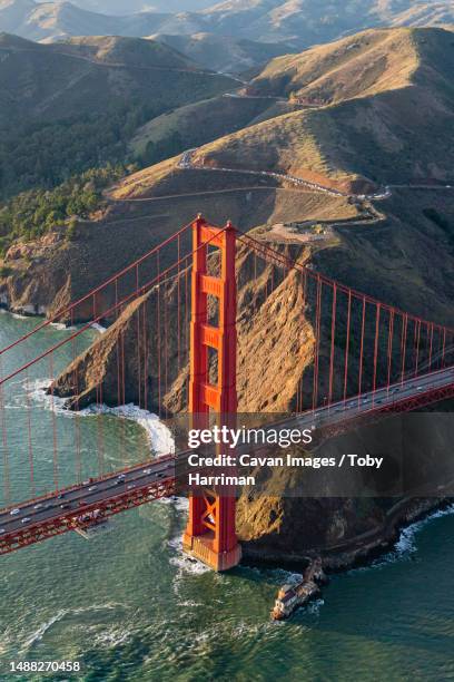 golden hate bridge with marin headlands in backdrop - aerial photo - bay area stock pictures, royalty-free photos & images