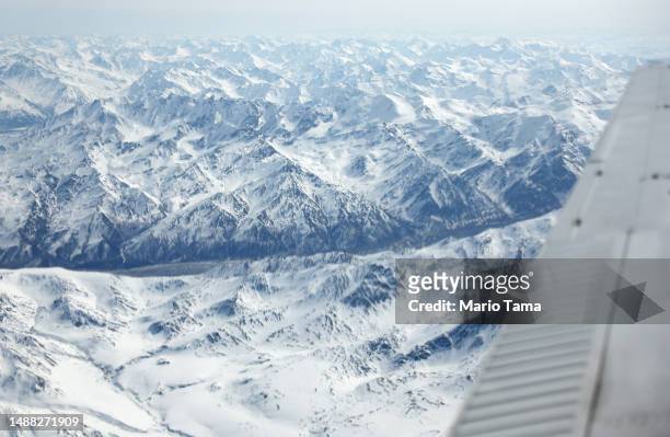 The Alaska Range is viewed from a NASA SnowEx research aircraft, which is studying changes in snow albedo in the Interior Alaska region during the...