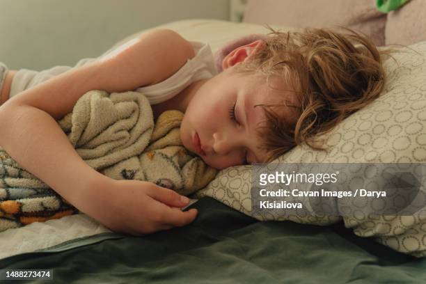cute boy sleeps at six - child eyes closed stock pictures, royalty-free photos & images