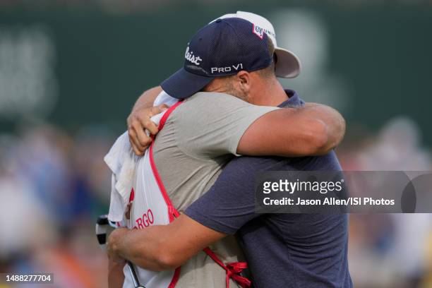 Wyndham Clark of the United States shows emotion after putting to win the tournament on the 18th hole during the Final Round at the Wells Fargo...