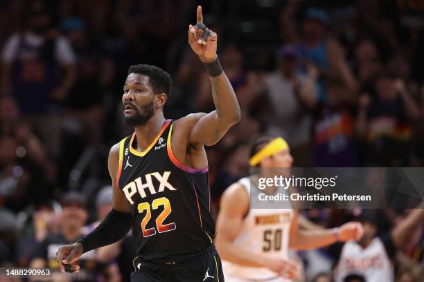 Deandre Ayton of the Phoenix Suns reacts after scoring against the Denver Nuggets during the first half of Game Four of the NBA Western Conference...