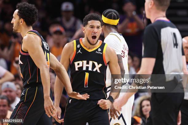 Devin Booker of the Phoenix Suns reacts after scoring against the Denver Nuggets during the first half of Game Four of the NBA Western Conference...