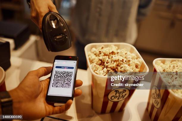 scanning online movie ticket! - movie counter stock pictures, royalty-free photos & images