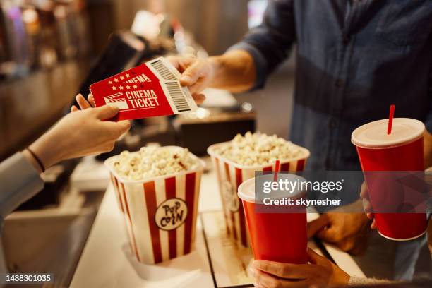 buying movie tickets! - film screening stockfoto's en -beelden