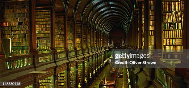 longroom in the old library of trinity college. - trinity college dublin library stock pictures, royalty-free photos & images