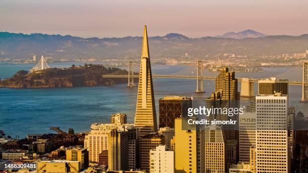 view of modern cityscape with island - san francisco financial district stock pictures, royalty-free photos & images