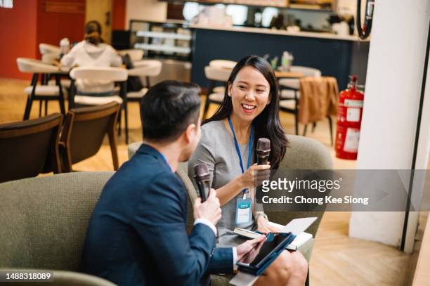 two lecturers are talking during conference. - rate announcement news conference stock pictures, royalty-free photos & images