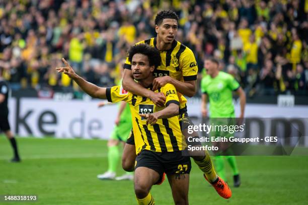 Karim Adeyemi of Borussia Dortmund celebrates after scoring his team's fifth goal with Jude Bellingham of Borussia Dortmund during the Bundesliga...