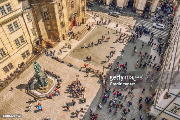 high angle view of a town square near the entry of charles bridge in prague - stare mesto stock pictures, royalty-free photos & images