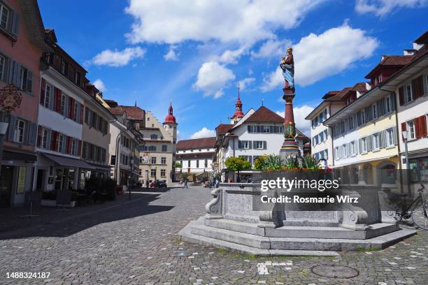 historical town square of sursee, with old fountain - town hall tower stock pictures, royalty-free photos & images