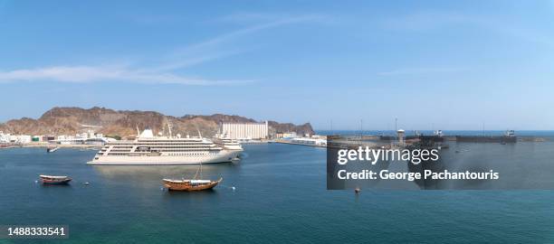 panorama of sultan qaboos port in muscat, oman - dhow stock pictures, royalty-free photos & images