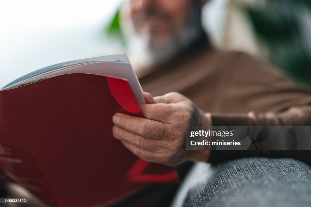 Close Up Shot of an Anonymous Man Holding a Book