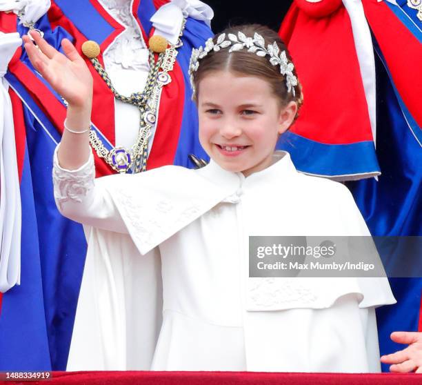 Princess Charlotte of Wales watches an RAF flypast from the balcony of Buckingham Palace following the Coronation of King Charles III & Queen Camilla...