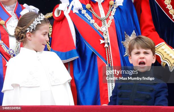 Princess Charlotte of Wales and Prince Louis of Wales watch an RAF flypast from the balcony of Buckingham Palace following the Coronation of King...