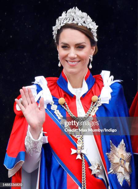 Catherine, Princess of Wales watches an RAF flypast from the balcony of Buckingham Palace following the Coronation of King Charles III & Queen...