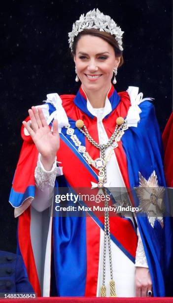 Catherine, Princess of Wales watches an RAF flypast from the balcony of Buckingham Palace following the Coronation of King Charles III & Queen...