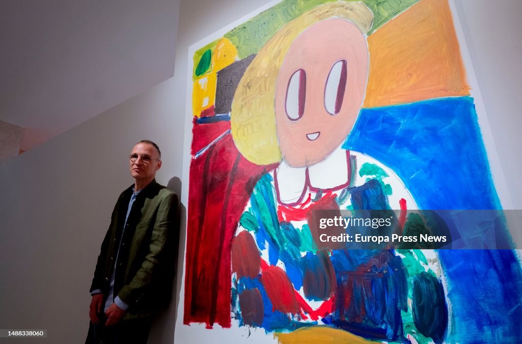 Al Butzer Artist Andre Butzer poses next to one of his first retrospective ...