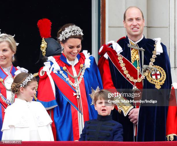 Princess Charlotte of Wales, Prince Louis of Wales, Catherine, Princess of Wales and Prince William, Prince of Wales watch an RAF flypast from the...