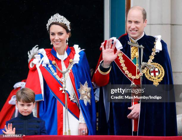 Prince Louis of Wales, Catherine, Princess of Wales and Prince William, Prince of Wales watch an RAF flypast from the balcony of Buckingham Palace...