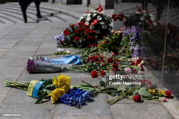 Flowers lay at Soviet War Memorial Tiergarten to commemorate the 1945 liberation of Germany from fascism and the end of World War II on VE Day on May...