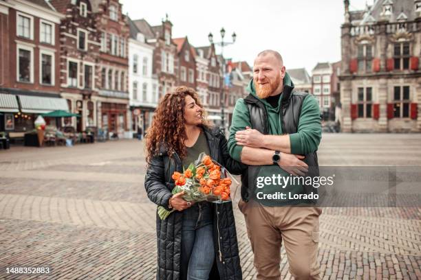 a foreign traveller couple on a date in delft - real people shopping stock pictures, royalty-free photos & images
