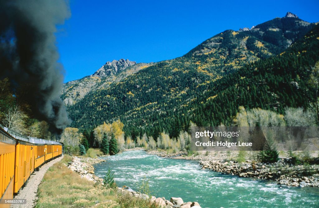 Train and Animas River, Durango and Silverton Narrow Gauge Railway.