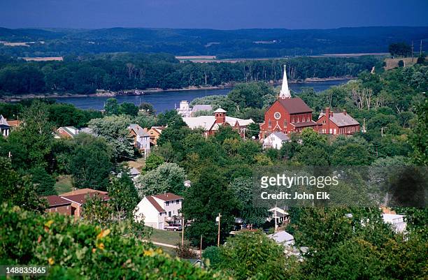 overhead of town buildings, trees and river. - missouri stock pictures, royalty-free photos & images