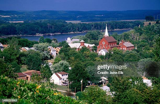 overhead of town buildings, trees and river. - herrmann stock pictures, royalty-free photos & images