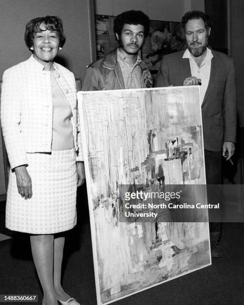 Franklin Burwell , winner of a purchase prize in a student art exhibit at North Carolina Central University, standing with Minnie Spaulding,...