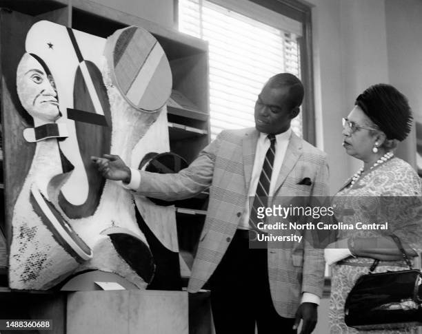 James Pointer, North Carolina College junior art major of Boston, Massachusetts, talking with Miss Pope, acting dean of the North Carolina Central...