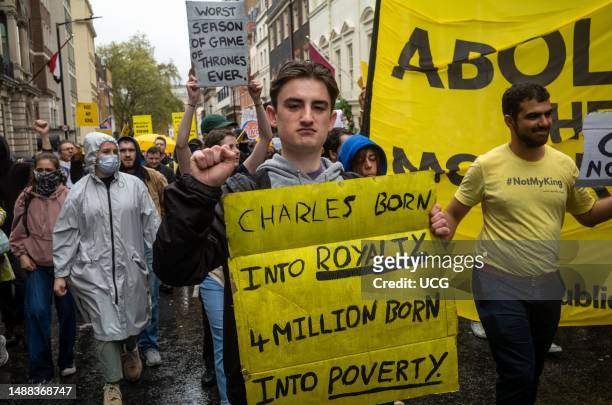 An anti-monarchy protestor clenches his fist as he demonstrates in central London on 6 May as the coronation of King Charles III took place a short...