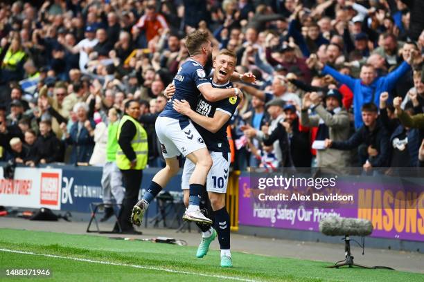 Tom Bradshaw of Millwall celebrates after scoring a goal with teammate Zian Flemming, which is later ruled out following an offside-decision, during...