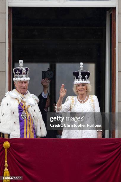 Getty Images photographer Chris Jackson photographs King Charles III and Queen Camilla on the Buckingham Palace balcony during the flypast during the...