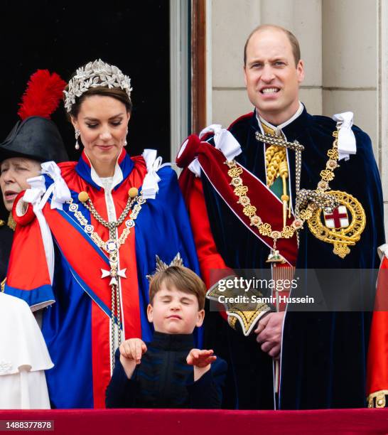 Catherine, Princess of Wales, Prince Louis of Wales and Prince William, Prince of Wales on the balcony of Buckingham Palace following the Coronation...